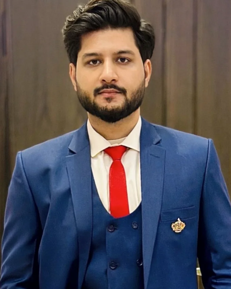 Sameed Abid, business operations and automation professional, in a navy three-piece suit